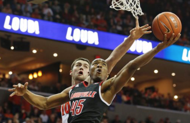 Louisville guard Donovan Mitchell (45) shoots as Virginia center Mike Tobey (10) defends during the second half of an NCAA college basketball game in Charlottesville, Va., Saturday, March 5, 2016. Virginia won 68-46. (AP Photo/Steve Helber)