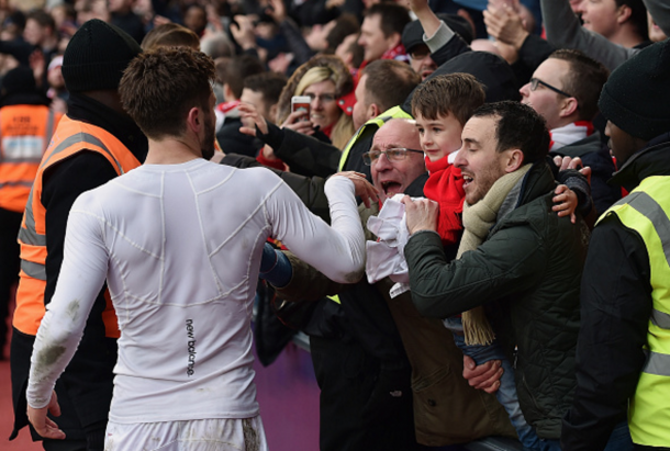 Lallana gives his shirt to a fan at the end of Sunday's victory. (Picture: Getty Images)