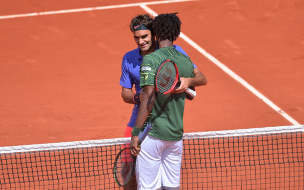 Roger Federer of Switzerland shakes hands with Gael Monfils of France after their men's singles fourth round match against on day nine of the French Open at Roland Garros on June 1, 2015 in Paris, France. (Photo by Aurelien Meunier/Getty Images)