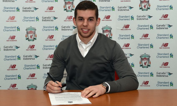 Flanagan puts pen-to-paper on his new contract at the club. (Picture: Getty Images)