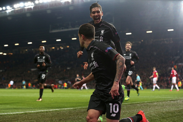 Firmino celebrates Coutinho's goal in the Reds' second-leg draw with United recently. (Picture: Getty Images)