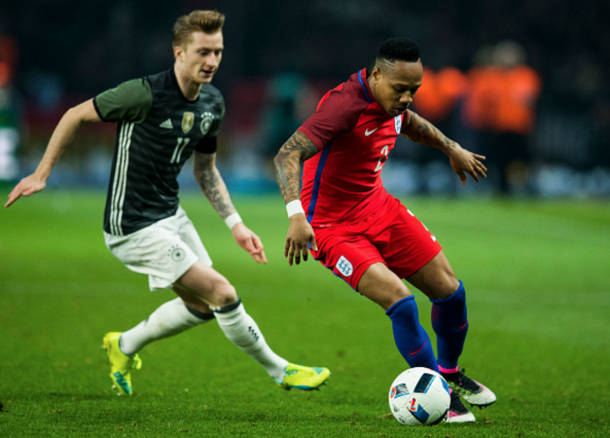 Nathaniel Clyne attempts to evade Marco Reus, who he will face at club level next month. (Picture: Getty Images)