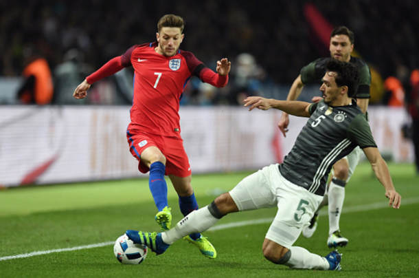 Adam Lallana is tackled by Mats Hummels, another duel that will commence in the Europa League in April. (Picture: Getty Images)