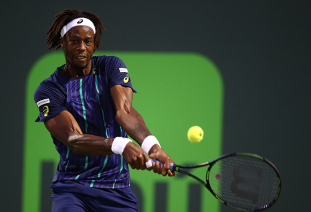 Gael Monfils of France plays a backhand against Grigor Dimitrov of Bulgaria in their fourth round match during the Miami Open Presented by Itau at Crandon Park Tennis Center on March 29, 2016 in Key Biscayne, Florida. (Photo by Clive Brunskill/Getty Images)