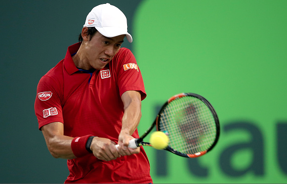 Kei Nishikori returns a shot during his semifinal match.  Photo Courtesy: Getty Images Sport | Matthew Stockman