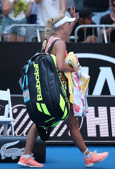 Caroline Wozniacki exits the court after her first round loss at the Australian Open.  Photo Courtesy: Getty Images Sport | Michael Dodge