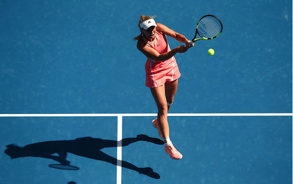 Wozniacki plays a backhand at the Australian Open.  Photo Courtesy: Getty Images Sport | Mark Kolbe