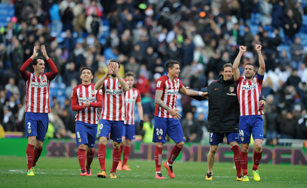 Diego Godin, Matias Kranevitter, Jose Maria Gimenez, Fernando Torres and Gabi Fernandez of Club Atletico de Madrid celebrate after they beat Real 1-0 in the La Liga match between Real Madrid CF and Club Atletico de Madrid at Estadio Santiago Bernabeu on February 27, 2016 in Madrid, Spain. (Photo by Denis Doyle/Getty Images)