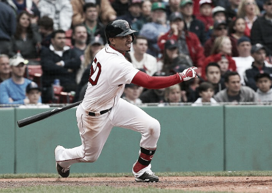 Mookie Betts drives in the go-ahead run in the seventh inning for the Red Sox. | AP 