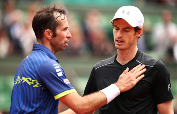 Andy Murray of Great Britain talks with Radek Stepanek of the Czech Republic following the Men's Singles first round match on day three of the 2016 French Open at Roland Garros on May 24, 2016 in Paris, France. (Photo by Clive Brunskill/Getty Images)