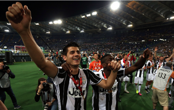 Alvaro Morata of Juventus FC celebrates with trophy after the Tim Cup Final during the TIM Cup match between AC Milan and Juventus FC at Stadio Olimpico on May 21, 2016 in Rome, Italy. (Photo by Gabriele Maltinti/Getty Images)