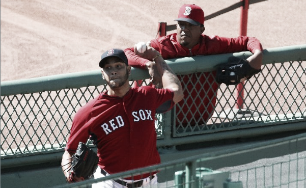 Eduardo Rodriguez throws a bullpen session with Hall of Famer Pedro Martinez looking on. | Getty