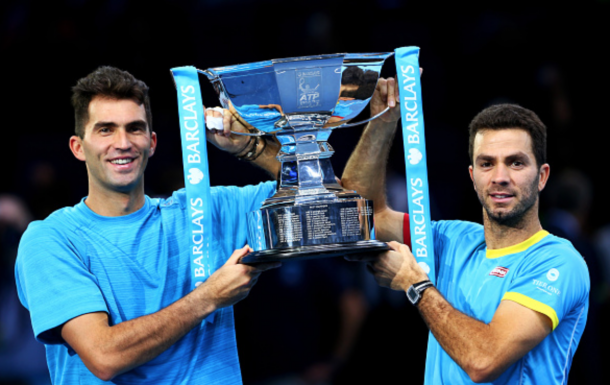 Horia Tecau of Romania and Jean-Julien Rojer of France lift the trophy following their victory during the men's doubles final against Rohan Bopanna of India and Florin Mergea of Romania on day eight of the Barclays ATP World Tour Finals at the O2 Arena on November 22, 2015 in London, England. (Photo by Clive Brunskill/Getty Images)