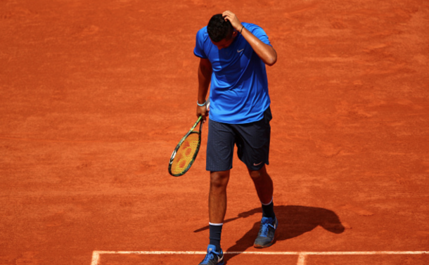 A dejected Nick Kyrgios of Australia reacts during the Men's Singles third round match against Richard Gasquet of France on day six of the 2016 French Open at Roland Garros on May 27, 2016 in Paris, France. (Photo by Clive Brunskill/Getty Images)