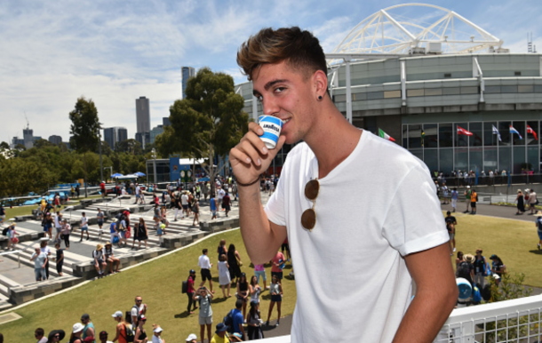 Thanasi Kokkinakis of Australia enjoys a short black coffe at Lavazza on Grand Slam Oval during day two of the 2016 Australian Open at Melbourne Park on January 19, 2016 in Melbourne, Australia. (Photo by Vince Caligiuri/Getty Images)