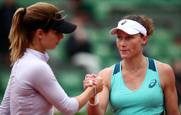 Samantha Stosur of Australia shakes hands with Tsvetana Pironkova of Bulgaria following her victory during the Ladies Singles quarter final match on day eleven of the 2016 French Open at Roland Garros on June 1, 2016 in Paris, France. (Photo by Clive Brunskill/Getty Images)