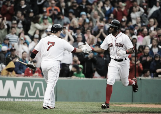 Chris Young is congratulated by teammate Christian Vazquez after his fourth home run of the season. | AP
