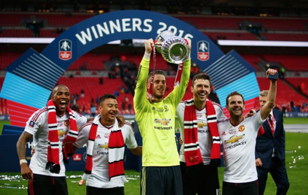 shley Young, Jesse Lingard, David De Gea, Michael Carrick and Juan Mata of Manchester United celebrate with the trophy after The Emirates FA Cup Final match between Manchester United and Crystal Palace at Wembley Stadium on May 21, 2016 in London, England. (Photo by Christopher Lee - The FA/The FA via Getty Images)