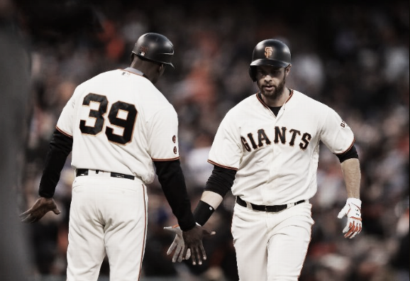 Brandon Belt celebrates his game-tying homer in the fourth inning. | Getty