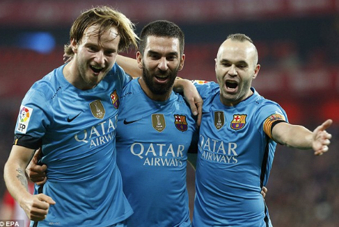 Turan celebrates with Andres Iniesta and Ivan Rakitic who play for Spain and Croatia respectively | Photo: EPA