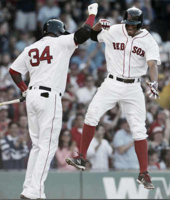 Xander Bogaerts celebrates with David Ortiz after his solo blast in the fifth inning. | AP