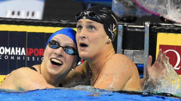 Katie Ledecky, left, reacts with Leah Smith after they finished 1-2 in the women's 400-meter freestyle final Monday in Omaha, Neb (Orlin Wagner / AP photo)