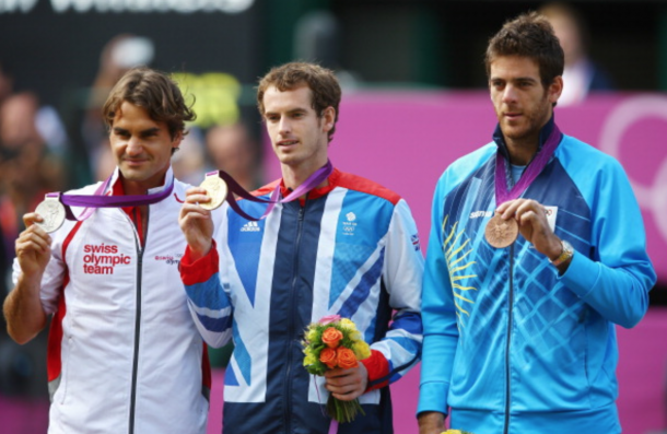 Silver medalist Roger Federer (L) of Switzerland, gold medalist Andy Murray (C) of Great Britain and bronze medalist Juan Martin Del Potro of Argentina pose during the medal ceremony for the Men's Singles Tennis match on Day 9 of the London 2012 Olympic Games at the All England Lawn Tennis and Croquet Club on August 5, 2012 in London, England. Murray defeated Federer in the gold medal match in straight sets 2-6, 1-6, 4-6. (Photo by Paul Gilham/Getty Images)