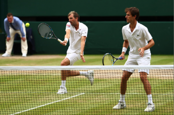 Benneteau (L) and Roger-Vasselin (R) at the net during the 2016 Wimbledon Gentlemen's Doubles Final (Julian Finney/Getty Images)