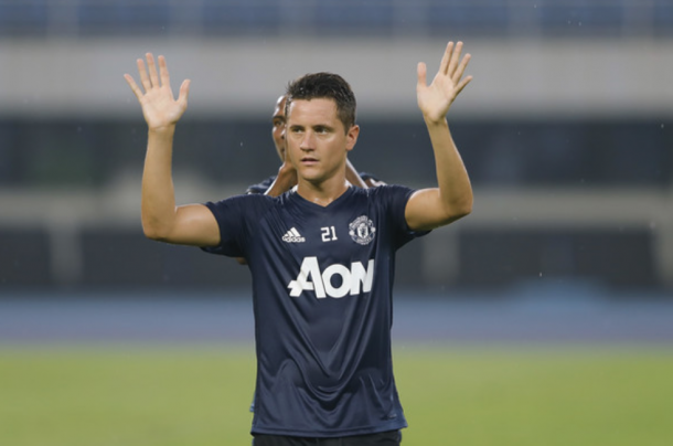 Ander Herrera waves to fans during the training session before the cancelled Derby (Lintao Zhang/Getty)