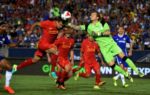 Karius and Lovren come together in the incident that left the 'keeper's hand damaged. (Picture: Getty Images)