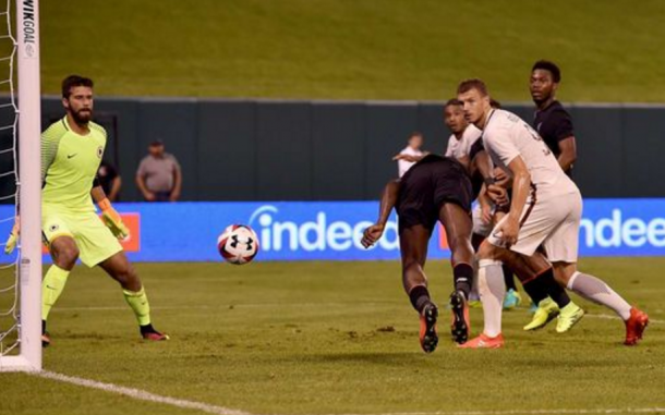 Ojo stoops to score for Liverpool on the brink of half-time. (Picture: Getty Images)