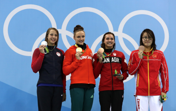 (From L to R) Baker with her silver medal, Hosszu with her gold medal, Canada's Kylie Masse and China's Yuanhui Fu with their bronze medals during the medal ceremony (Al Bello/Getty Images) 