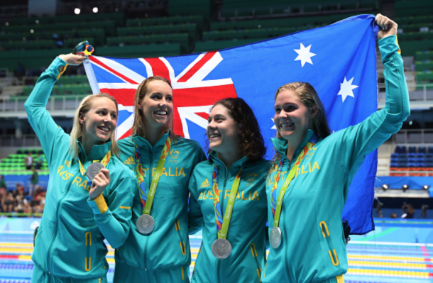 Neal, McKeon, Barratt, and Cook celebrate with their silver medals (Tom Pennington/Getty Images)