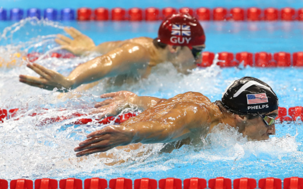 Phelps passing Guy in his final 50 meters in the pool (Al Bello/Getty Images)
