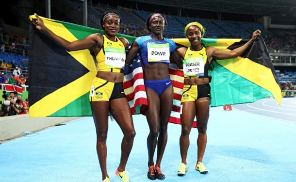 Thompson, Bowie, and Fraser-Pryce celebrate after the race (Ian Walton/Getty Images)
