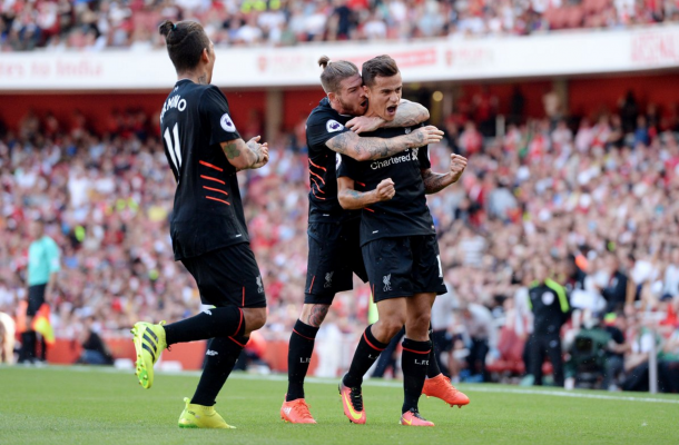 Coutinho celebrates after his stunning long-range free-kick made it 1-1 on Sunday. (Picture: Getty Images)