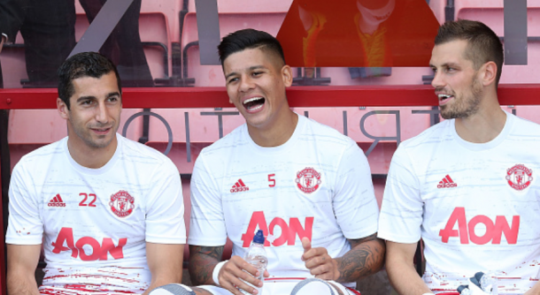 Mkhitayran (L) was on the bench for the first two United games of the season (John Peters/Getty Images)