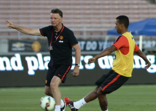 Nani getting instruction from Louis van Gaal (John Peters/Getty Images)