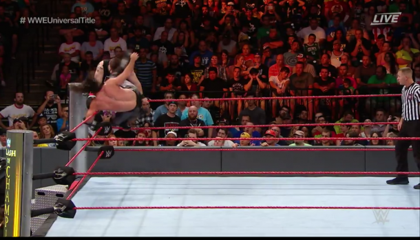 Owens goes up top but is met with a kick to his face courtesy of Rollins. (image: wwe network)