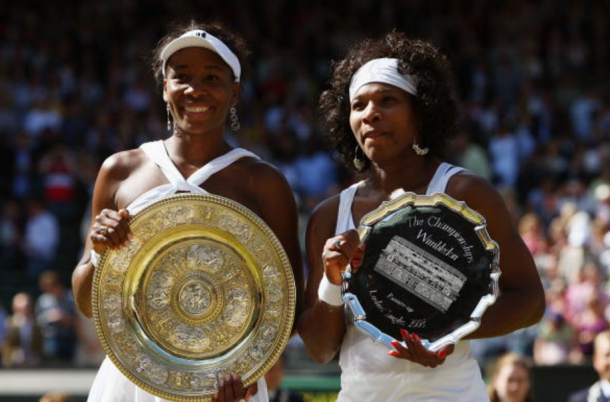 Venus and Serena pose with their trophies during the 2008 Wimbledon Final (Ryan Pierse/Getty Images)