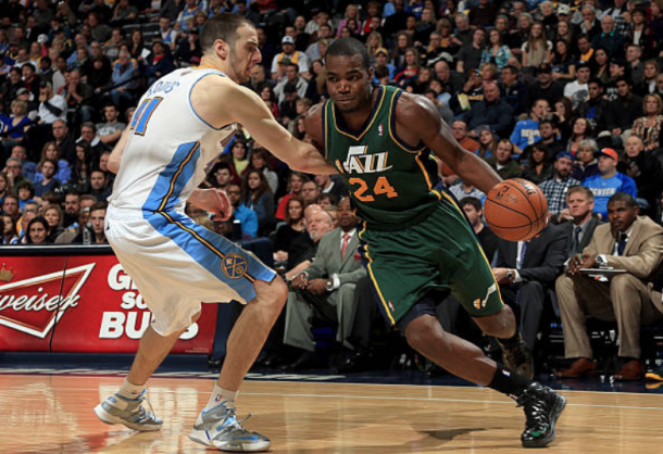 Millsap facing off against the Nuggets as a member of the Utah Jazz in 2013. (Photo by Doug Pensioner/Getty Images)