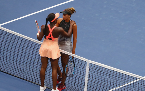 Good friend Madison and Sloane share an emotional hug at the net after the match (Al Bello/Getty Images)