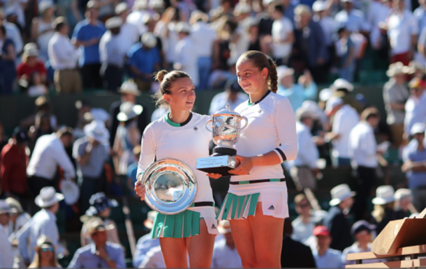 Halep and Ostapenko with their French Open trophies (Tim Clatyon/Corbis/Getty Images)