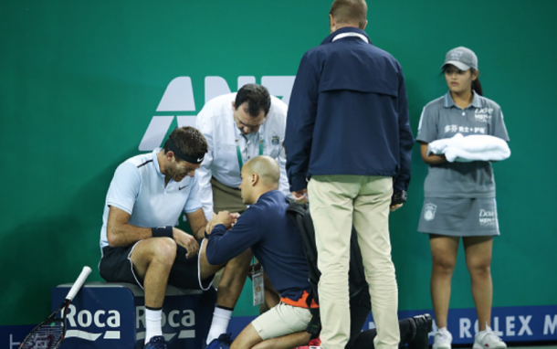 Del Potro getting his wrist checked out by the doctors (Lintao Zhang/Getty Images)