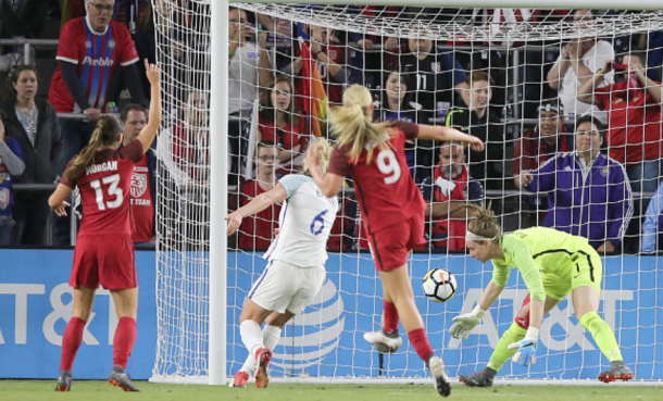 The ball deflects off England goalkeeper Karen Bardsley (far right) leg and into her net as the game's only goal. (Photo by Alex Menendez/ Getty Images)