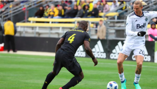 Jonathan Mensah defends Brek Shea of the Vancouver Whitecaps. | Photo: Crew SC