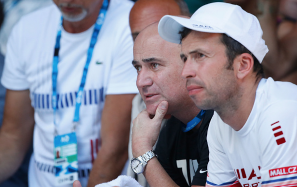 Agassi and Stepanek sitting in Djokovic's box during the Australian Open (Scott Barbour/Getty Images)