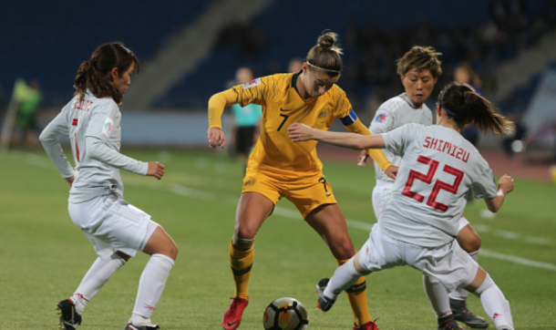 Seattle Reign FC and Matildas defender Steph Catley gets away from 3 Japan players with a "Messi" like move. (Photo by Salah Malkawi/Getty Images)