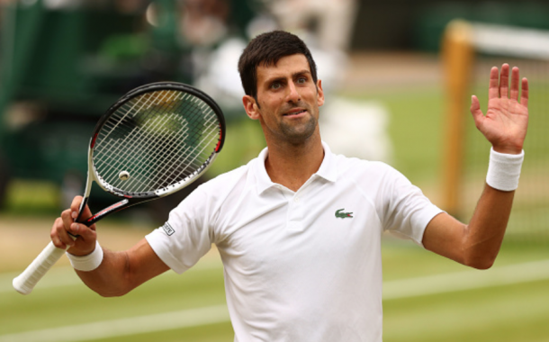 Djokovic all smiles as he comes through a brutal 15th game (Michael Steele/Getty Images)