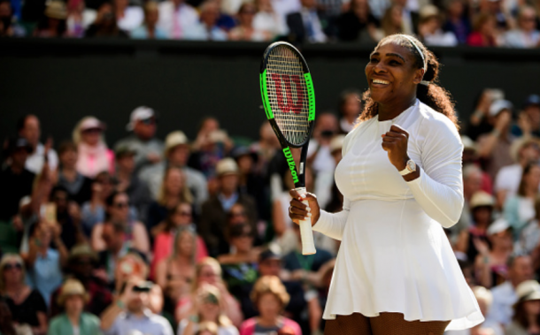 Serena all smiles after getting by her first major test at Wimbledon (TPN/Getty Images)